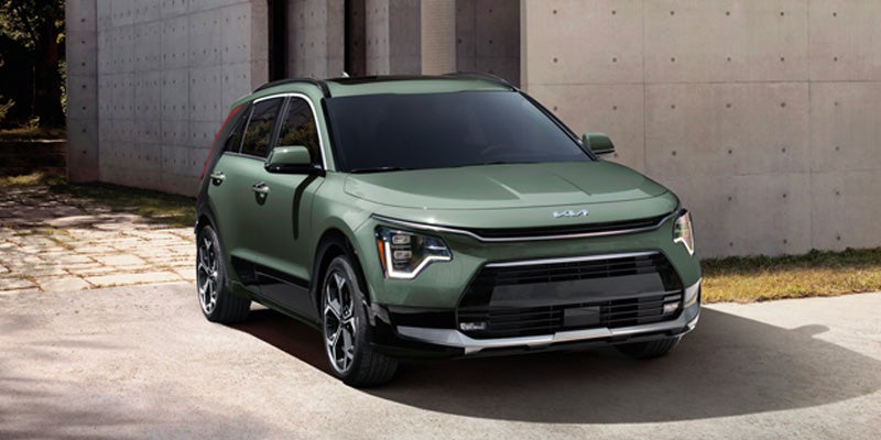 Kia SUV front view parked near modern building