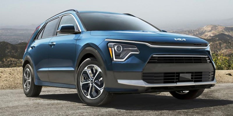 Kia SUV front three-quarter view on open road