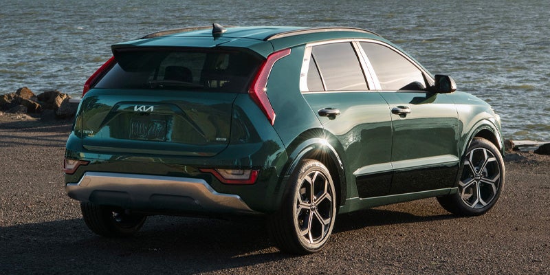 Kia SUV rear view parked near waterfront