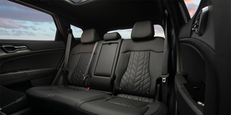 Interior of a car showcasing quilted black leather second-row seats.