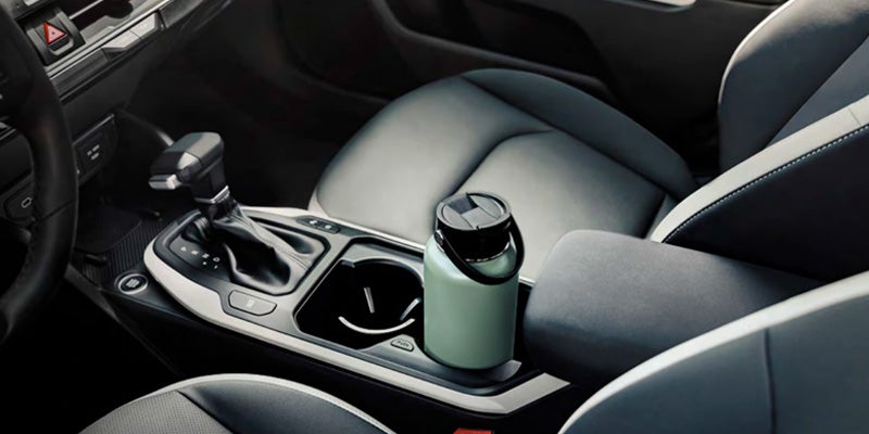 Kia K4 sedan interior center console with gear shifter and cup holder