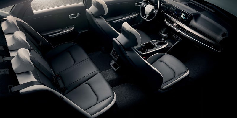 Kia K4 sedan interior showing front and rear seating layout