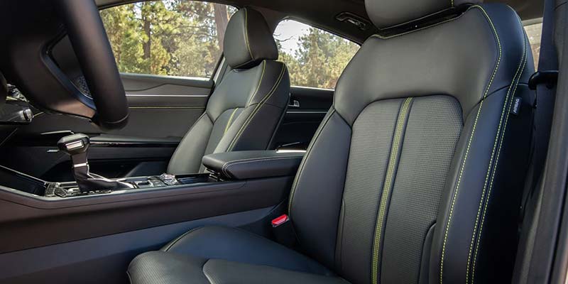 Front seats of car with black leather and contrast stitching