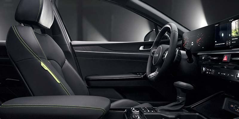 Modern car interior dashboard with digital display and steering wheel
